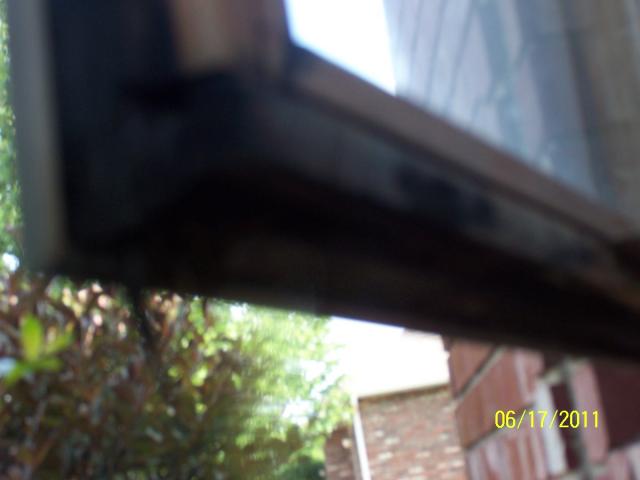 Severely deteriorated window trim.  Not visible from outside